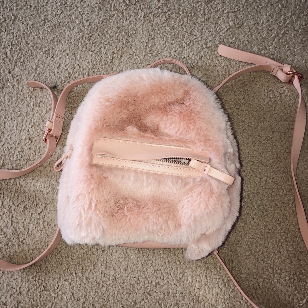AE fluffy mini backpack/clutch